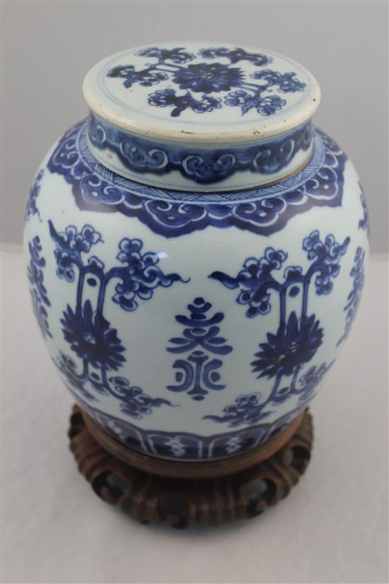A Chinese blue and white ovoid jar and cover, 19th century, 22.5cm, wood stand